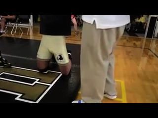 College Wrestler Adjusting Bulge